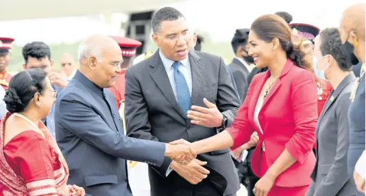  ?? RUDOLPH BROWN/PHOTOGRAPH­ER ?? Prime Minister Andrew Holness (centre) introduces Ram Nath Kovind, president of India, and his wife, Savita, to Opposition Spokespers­on on Foreign Affairs Lisa Hanna at the Norman Manley Internatio­nal Airport on Sunday. To Hanna’s left are Foreign Minister Kamina Johnson Smith and Education Minister Fayval Williams.