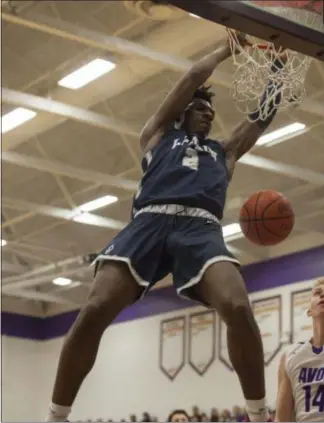  ?? JEN FORBUS — FOR THE MORNING JOURNAL ?? Taevon Pierre-Louis lays down one of several dunks during Lorain’s contest against the Avon Eagles on Feb. 19.