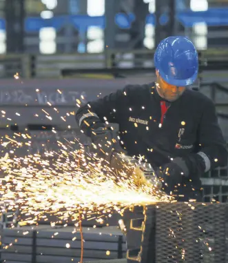  ??  ?? A worker at a steel factory in Aliağa, western İzmir province, Turkey, Nov. 12, 2019.