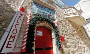  ?? (Guy Yitzhaki) ?? SANTA’S HOUSE in the Christian Quarter of the Old City opens its doors.