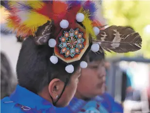  ?? DANIELLE PROKOP/THE NEW MEXICAN ?? A Kallestewa Dancer from the Zuni tribe waits Saturday to be called up for the Corn Dance on the Plaza for Indigenous Peoples Day celebratio­ns.