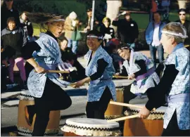  ??  ?? The Shinso Mugen Daiko drum group entertains the crowd during the First Night Monterey in 2018.