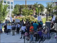  ?? RACHEL RAVINA - MEDIANEWS GROUP ?? People hold up signs while attending a rally last summer in Norristown ahead of the closure of a homeless shelter in Montgomery County.