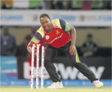  ?? ?? Odean Smith of Guyana Amazon Warriors effects the run out of Mohammad Amir (not pictured) of Jamaica Tallawahs during the Hero Caribbean Premier League match at Providence Stadium in Guyana on Wednesday.