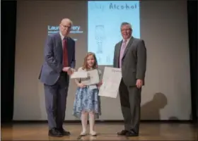  ?? SUBMITTED PHOTO ?? First Place Calendar Winner Lauren Avery, grade 2, Schuylkill Valley Elementary School, with Pennsylvan­ia Liquor Control Board Chairman Tim Holden, left, and Executive Director Charlie Mooney, right.