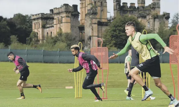  ??  ?? 0 Tom Rogic, left, Scott Sinclair, centre, and Mikael Lustig take part in training at Lennoxtown yesterday as Celtic prepared to face Paris Saint Germain tonight.