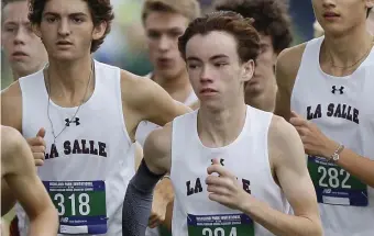  ?? PAUL CONNORS / bOStON HeRALd ?? OUT IN FRONT: La Salle’s Jack Casey leads the field during the boys’ varsity race at the Highland Park Cross Country Invitation­al on Saturday in Attleboro.