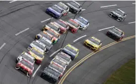  ?? (Brian Lawdermilk//getty) ?? Bubba Wallace, driver of the #23 Mcdonald’s Toyota, leads the field during the Cup Series Yellawood 500 at Talladega Superspeed­way Monday.