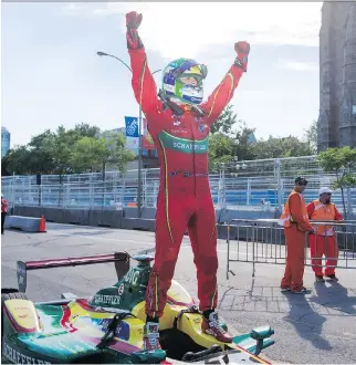  ?? RYAN REMIORZ /THE CANADIAN PRESS ?? Lucas Di Grassi of Brazil raises his arms in victory after winning the Formula E drivers championsh­ip, despite finishing seventh in the inaugural Montreal ePrix.