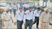  ??  ?? Traffic cops gathered at the Police Lines following the premature retirement order against their three colleagues in Ludhiana on Wednesday. JAGTINDER SINGH GREWAL/HT