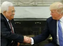  ?? (Jonathan Ernst/Reuters) ?? US PRESIDENT Donald Trump welcomes PA President Mahmoud Abbas in the Oval Office on Wednesday.