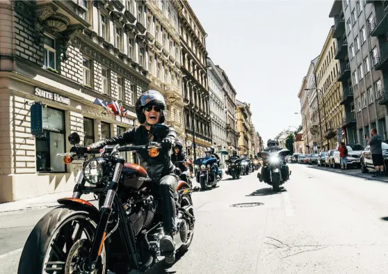  ??  ?? WOMAN AND MACHINE Riders rumbled down the streets of Old Town in Prague on a victory parade, (lbelow); The yet-to-belaunched all-electric H-D Livewire (right)