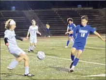  ?? NICK MALLARD / SENTINEL & ENTERPRISE ?? Nashoba Regional's Tyler Mignault plays the ball under pressure from Leominster's Pablo Ruan Delphormo on Wednesday. At 15-0-2, the Blue Devils are riding high entering the state tournament.