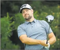  ?? Andy Lyons / Getty Images ?? Leader Ryan Moore watches his tee shot on the 17th hole during the first round of The Memorial Tournament at Muirfield Village Golf Club on Thursday in Dublin, Ohio.