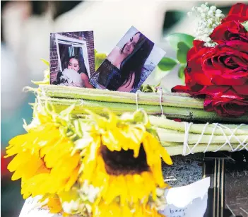  ?? MARK BLINCH / THE CANADIAN PRESS ?? Photograph­s of Reese Fallon are seen at a memorial in the Danforth parkette where she died.