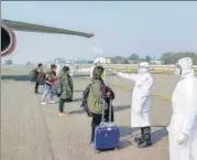  ?? PTI ?? Health officials screen Indians who were evacuated from Wuhan, at n the airport in New Delhi, on February 2.