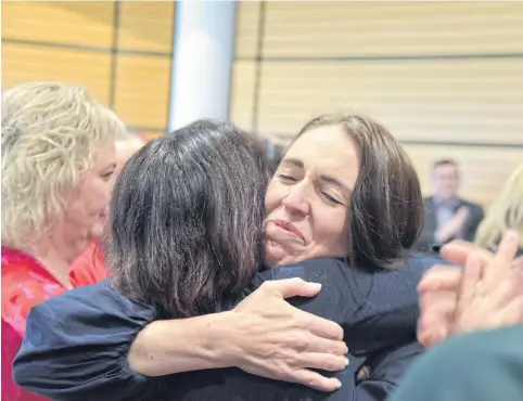  ?? REUTERS ?? New Zealand Prime Minister Jacinda Ardern reacts following the announceme­nt of her resignatio­n at the War Memorial Hall in Napier on Thursday.