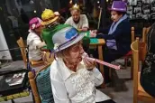  ?? Alvaro Barrientos / Associated Press ?? Conchita, 90, a resident of the San Jeronimo nursing home, plays a party horn during New Year’s Eve celebratio­ns in Estella, northern Spain.