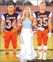  ?? Photo by Randy Moll ?? Senior Zoe Betz was escorted by Dylan Gruver and Brandon Ballard at Gravette High School homecoming ceremonies in Lion Stadium on Oct. 21.