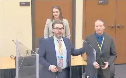 ?? COURTTV ?? In an image from video, defense attorney Eric Nelson, left, former police Officer Derek Chauvin and defense assistant AmyVoss introduce themselves to potential jurors last week in Minneapoli­s. Chauvin is charged in the death of George Floyd.