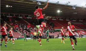  ?? Photograph: Naomi Baker/EPA ?? Che Adams leaps with delight after giving Southampto­n the lead against Sheffield United.