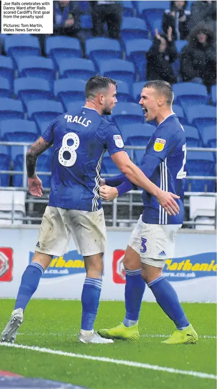  ??  ?? Joe Ralls celebrates with Danny Ward after Ralls scored Cardiff’s first goal from the penalty spot
Pictures: Tom Martin, Wales News Service