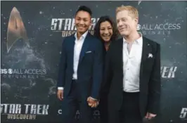  ??  ?? In this file photo, Anthony Rapp, right, a cast member in “Star Trek: Discovery,” poses with his boyfriendT­eerakeni and fellow cast member Michelle Yeoh at the premiere of the new television series in Los Angeles.