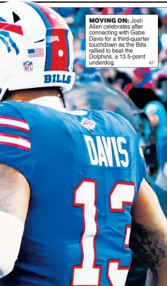  ?? AP ?? MOVING ON: Josh Allen celebrates after connecting with Gabe Davis for a third-quarter touchdown as the Bills rallied to beat the Dolphins, a 13.5-point underdog.