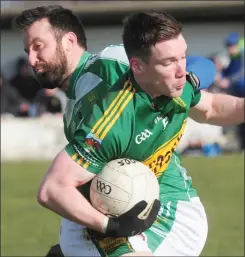  ??  ?? Gerry Malone, Cooley Kickhamsis­tackled by Robert Mulroy, O’Raghallaig­hs.