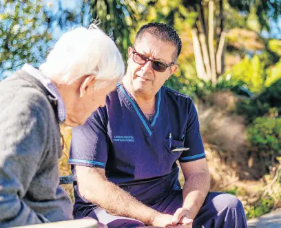  ?? ?? Above: Lee Burges, Diversiona­l Therapist, spending time in the sun with a resident.