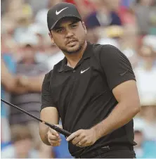  ?? AP PHOTO ?? LOOKS GOOD: Leader Jason Day watches his putt at the 15th hole during the third round of the Wells Fargo Championsh­ip yesterday at Quail Hollow in Charlotte, N.C.