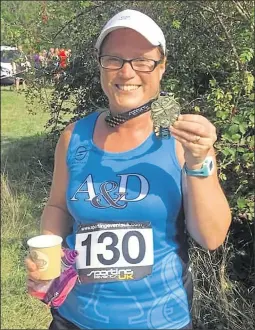  ??  ?? Ashford & District’s Lucy Johnstone at the Shorne Woods 5 Mile race