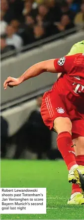  ??  ?? Robert Lewandowsk­i shoots past Tottenham’s Jan Vertonghen to score Bayern Munich’s second goal last night