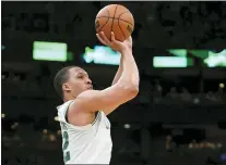  ?? STEVEN SENNE — THE ASSOCIATED PRESS ?? Boston Celtics forward Grant Williams shoots during the second half of Game 7Sunday in Boston. Behind 22threepoi­nters, the Celtics knocked off the Bucks to move on to the conference final.