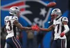  ?? STAFF PHOTO BY CHRISTOPHE­R EVANS/ MEDIANEWS GROUP/ BOSTON HERALD ?? ATLANTA, GA - FEBRUARY 3: Patrick Chung and J.C. Jackson congratula­te each other near the end of first quarter to Super Bowl LIII at Mercedes-Benz Stadium in Atlanta, Georgia on February 3, 2019.