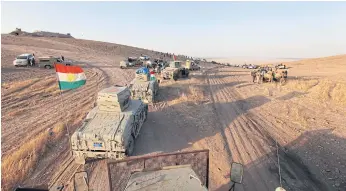  ??  ?? ON THE OFFENSIVE: Military vehicles of Kurdish Peshmerga forces prepare to launch an operation against Isis in the southeast of Mosul in Iraq in August.