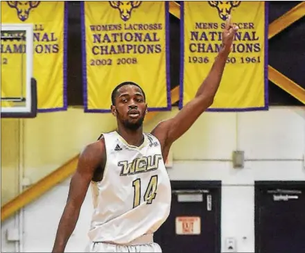  ?? PETE BANNAN — DIGITAL FIRST MEDIA ?? West Chester guard Tyrell Long signals after hiting a 3-pointer in the second half against California University on Friday. Long had a gamehigh 19 points in the 72-70 victory.