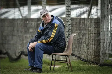  ??  ?? Deep in thought - Mick Hagan enjoys a quiet moment during the Junior C football final in Pearse’s Park, Arklow. Photo: Garry O’Neill