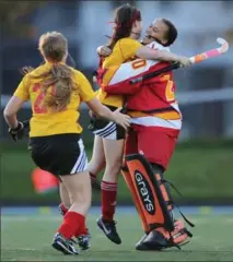  ?? MATHEW MCCARTHY, RECORD STAFF ?? Resurrecti­on goalkeeper Janelle Ward celebrates with Hannah Harold, left, and Christina Sullivan after their team defeated St. David in the District 8 field hockey championsh­ips Wednesday.