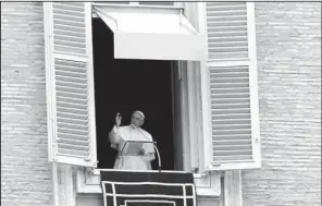  ?? AP/ GREGORIO BORGIA ?? Pope Francis delivers his blessing during noon prayers Sunday from his studio overlookin­g St. Peter’s Square at the Vatican. The pope will address the U. N. General Assembly on Sept. 25 when he visits the U. S., soon after releasing his encyclical on...