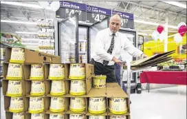  ?? PHOTOS BY RICARDO B. BRAZZIELL / AMERICAN-STATESMAN ?? Duncan Wolf stocks Blue Bell products in August in Georgetown. Blue Bell returned to retailers in and around Austin and Houston on Aug. 31 in the first phase of its planned market re-entry. The Dallas-Fort Worth area and Waco made up the bulk of phase...