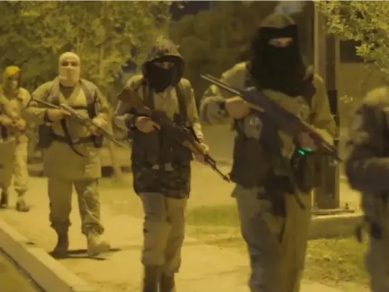  ??  ?? A still image taken from an Isis video claiming to show militants patrolling the streets of Mosul (Reuters)