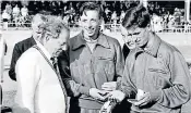  ??  ?? Sheil (centre) after winning gold at the 1958 Commonweal­th Games