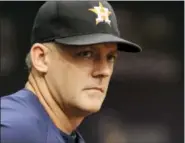  ?? STEVE NESIUS — THE ASSOCIATED PRESS ?? Houston Astros manager A.J. Hinch watches his team from the dugout during a baseball game against the Texas Rangers Thursday in St. Petersburg, Fla.