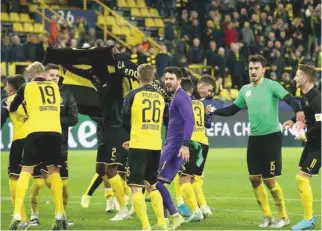  ?? – Joachim Bywaletz/Xinhua ?? ACE GAME: Players of Dortmund celebrate after a UEFA Champions League group F football match between Borussia Dortmund and Slavia Prague in Dortmund.