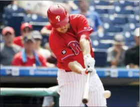  ?? MATT SLOCUM — THE ASSOCIATED PRESS ?? Phillies’ Tommy Joseph hits a two-run single off Cardinals relief pitcher Kevin Siegrist, Thursday in Philadelph­ia. Philadelph­ia won 5-1.