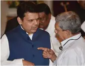  ?? — PTI ?? Maharashtr­a CM Devendra Fadnavis with Goa CM Manohar Parrikar at the swearing-in ceremony of vice-president M. Venkaiah Naidu at the Durbar Hall of Rashtrapat­i Bhavan on Friday.