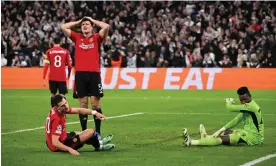  ?? Photograph: Anadolu Agency/Getty Images ?? Harry Maguire, Diogo Dalot and André Onana try to make sense of Manchester United’s late collapse against Copenhagen.