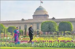  ?? PTI ?? President Ram Nath Kovind and First Lady Savita Kovind stroll at the Mughal Gardens at Rashtrapat­i Bhavan in New Delhi on Monday, a day before the gardens open for public view.