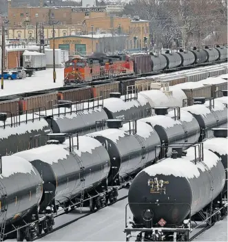  ?? The Associated Press/files ?? Rail cars are backed up in the yard after a train derailment and explosion this week in North Dakota. A study suggests crude oil from the Bakken area may be more flammable than convention­al oil.